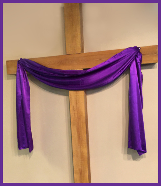 Cross draped with borders